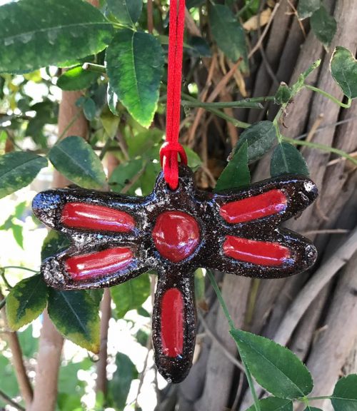 red ceramic dragonfly hanging