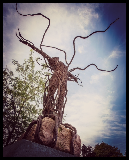 sculpture depicting triumph over sickness